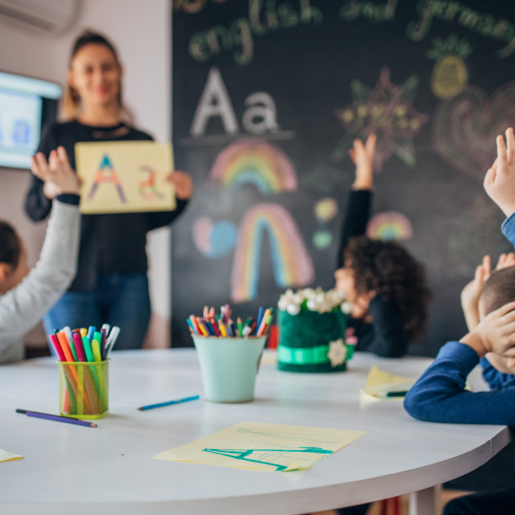Young children learning English in a cheerful classroom